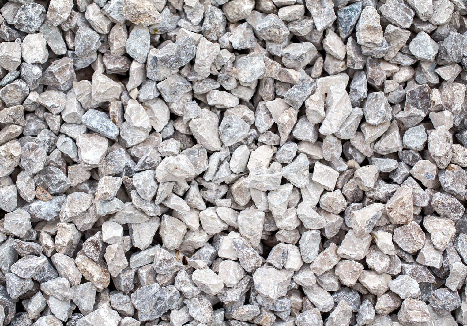 Closeup Of Small Little Grey Beige Blue Broken Crushed Stones Ro 3/4" Crushed Stone