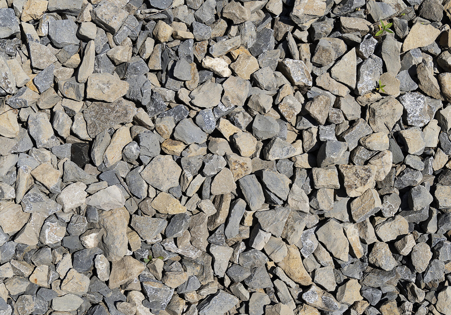 The Texture Of Stone Gravel Gray. Stone Rubble Gray Poured Pile 1 1/2" Crushed Stone